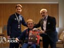 Joe receiving an award from Burnley FC chairman Alan Pace