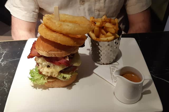 The Connoisseur’s Choice, a hand-formed sirloin steak burger with house fries and pepper sauce, with added Lancashire mature cheese and dry-cured pancetta.