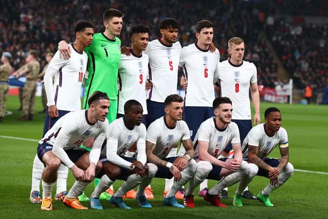 (back row L-R) England's midfielder Jude Bellingham, England's goalkeeper Nick Pope, England's striker Ollie Watkins, England's defender Tyrone Mings, England's defender Harry Maguire and England's midfielder James Ward-Prowse, (front row L-R) England's midfielder Jack Grealish, England's defender Tyrick Mitchell, England's defender Ben White, England's midfielder Declan Rice and England's midfielder Raheem Sterling pose for a team photo before the international friendly football match between England and Ivory Coast at Wembley stadium in north London on March 29, 2022.