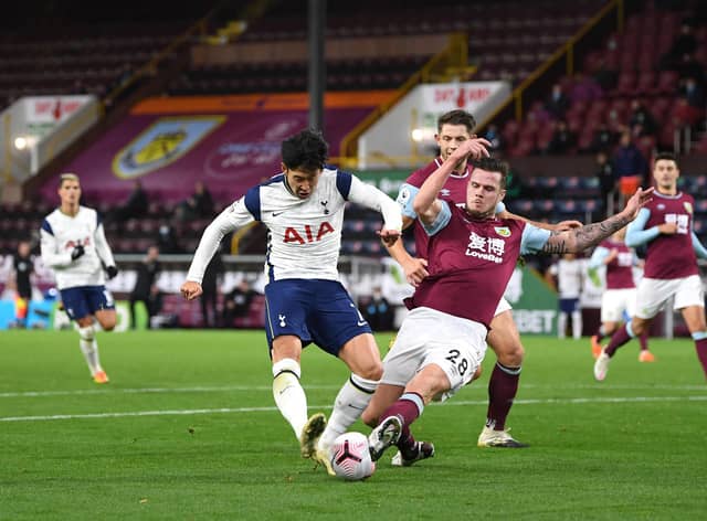 BURNLEY, ENGLAND - OCTOBER 26: Son Heung-Min of Tottenham Hotspur has a shot blocked by Kevin Long of Burnley  during the Premier League match between Burnley and Tottenham Hotspur at Turf Moor on October 26, 2020 in Burnley, England. Sporting stadiums around the UK remain under strict restrictions due to the Coronavirus Pandemic as Government social distancing laws prohibit fans inside venues resulting in games being played behind closed doors. (Photo by Michael Regan/Getty Images)