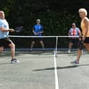 Pickleball players take part in a doubles match in Chorley