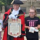 Bethany Marshall (right) and her best friend Daisie Lumsden who are both 10. Pictured here with the Mayor of Burnley Coun. Cosima Towneley at the Royal Proclamation last weekend, Bethany crocheted a crown which she presented at the event with a marmalade sandwich as a nod to the Queen's encounter with Paddington Bear during her Platinum Jubilee.