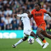 LEEDS, ENGLAND - MARCH 17: Michael Obafemi of Millwall is challenged by Glen Kamara of Leeds United during the Sky Bet Championship match between Leeds United and Millwall at Elland Road on March 17, 2024 in Leeds, England. (Photo by Ed Sykes/Getty Images)