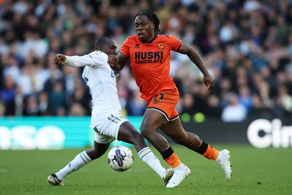 LEEDS, ENGLAND - MARCH 17: Michael Obafemi of Millwall is challenged by Glen Kamara of Leeds United during the Sky Bet Championship match between Leeds United and Millwall at Elland Road on March 17, 2024 in Leeds, England. (Photo by Ed Sykes/Getty Images)