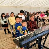 Music school teacher Janet Westmoreland with some of her students who performed at a charity concert at Simply Fields in Hurstwood