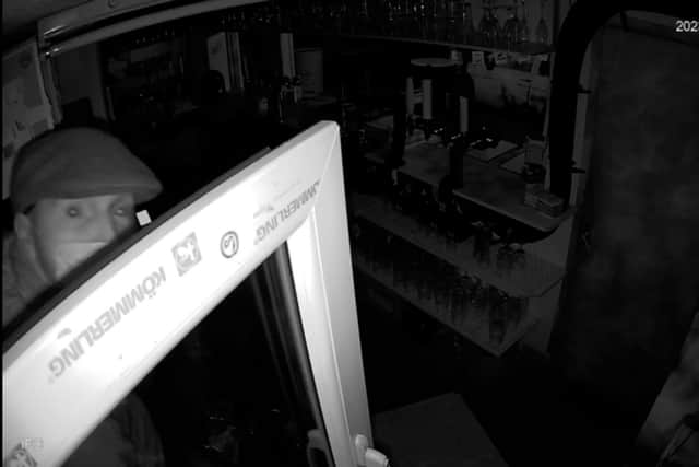 One of the raiders who broke into The Electric Circus music venue and bar on Hallowe'en looks directly at the CCTV. Can you identify him?
