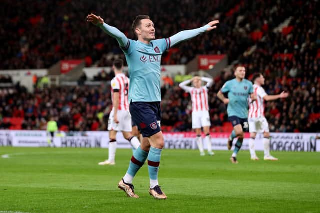STOKE ON TRENT, ENGLAND - DECEMBER 30: Connor Roberts of Burnley celebrates after Josh Cullen of Burnley (not pictured) scores their sides first goal during the Sky Bet Championship match between Stoke City and Burnley at Bet365 Stadium on December 30, 2022 in Stoke on Trent, England. (Photo by Charlotte Tattersall/Getty Images)