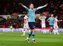STOKE ON TRENT, ENGLAND - DECEMBER 30: Connor Roberts of Burnley celebrates after Josh Cullen of Burnley (not pictured) scores their sides first goal during the Sky Bet Championship match between Stoke City and Burnley at Bet365 Stadium on December 30, 2022 in Stoke on Trent, England. (Photo by Charlotte Tattersall/Getty Images)