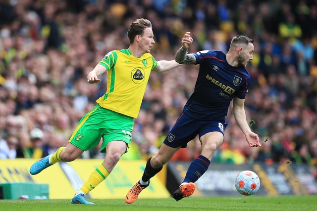 NORWICH, ENGLAND - APRIL 10: Josh Brownhill of Burnley holds off Kieran Dowell of Norwich City during the Premier League match between Norwich City and Burnley at Carrow Road on April 10, 2022 in Norwich, England. (Photo by Stephen Pond/Getty Images)