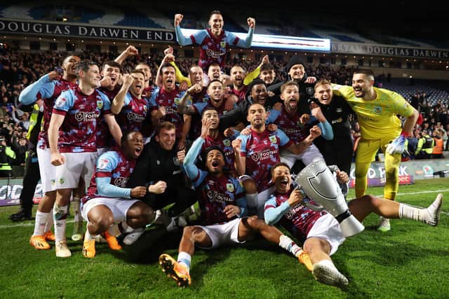 BLACKBURN, ENGLAND - APRIL 25: Burnley players celebrate after winning the Sky Bet Championship following victory against Blackburn Rovers and Burnley at Ewood Park on April 25, 2023 in Blackburn, England. (Photo by Matt McNulty/Getty Images)