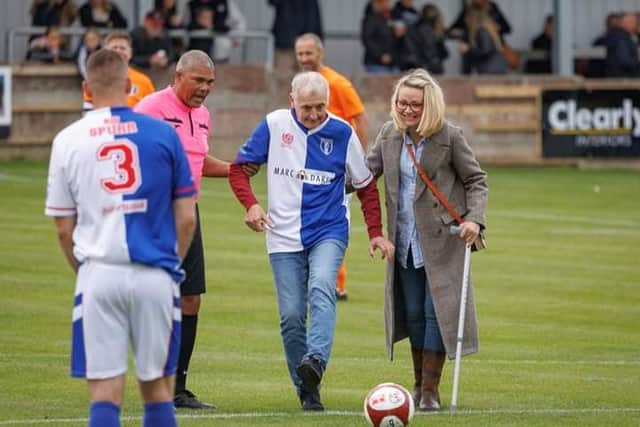 Tony Parkes kicks off a charity football match.