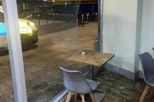 The aftermath at Charlatte's after vandals smashed the front window of the coffee shop in St James Street, Burnley