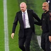 Burnley's English manager Sean Dyche (L) and Manchester City's Spanish manager Pep Guardiola (R) after the English League Cup fourth round football match between Burnley and Manchester City at Turf Moor in Burnley, north west England on September 30, 2020.