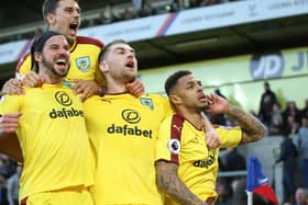LONDON, ENGLAND - APRIL 29:  Andre Gray (R) of Burnley celebrates scoring his team's second goal with Sam Vokes (C), George Boyd (L) and Matthew Lowton (top) of Burnley during the Premier League match between Crystal Palace and Burnley at Selhurst Park on April 29, 2017 in London, England.  (Photo by Steve Bardens/Getty Images)