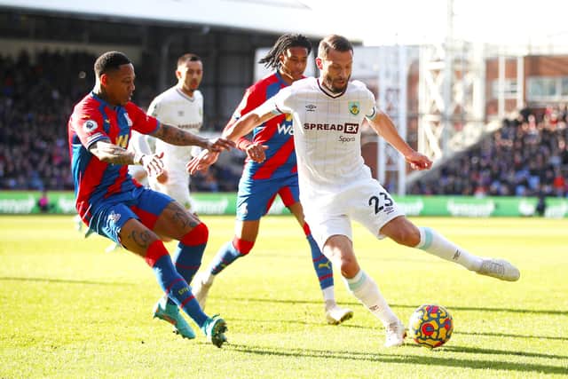 LONDON, ENGLAND - FEBRUARY 26: Erik Pieters of Burnley is challenged by Nathaniel Clyne of Crystal Palace during the Premier League match between Crystal Palace and Burnley at Selhurst Park on February 26, 2022 in London, England. (Photo by Christopher Lee/Getty Images)