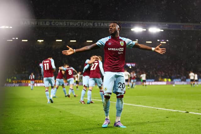 BURNLEY, ENGLAND - APRIL 06: Maxwel Cornet of Burnley celebrates after scoring their team's third goal during the Premier League match between Burnley and Everton at Turf Moor on April 06, 2022 in Burnley, England. (Photo by Clive Brunskill/Getty Images)