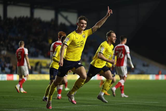 OXFORD, ENGLAND - NOVEMBER 23: Luke McNally of Oxford celebrates scoring the first goal during the Sky Bet League One match between Oxford United and Fleetwood Town at Kassam Stadium on November 23, 2021 in Oxford, England. (Photo by Richard Heathcote/Getty Images)