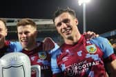 Johann Gudmundsson and Jack Cork of Burnley pose for a photo after winning the Sky Bet Championship following victory against the Blackburn Rovers and Burnley at Ewood Park on April 25, 2023 in Blackburn, England. (Photo by Matt McNulty/Getty Images)