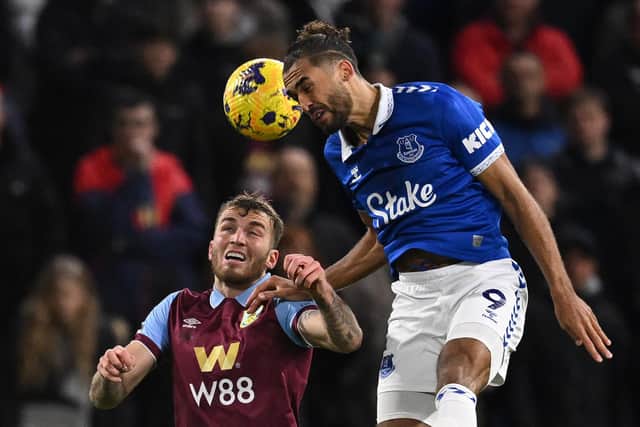 Burnley's German defender #05 Jordan Beyer (L) vies with Everton's English striker #09 Dominic Calvert-Lewin (R) during the English Premier League football match between Burnley and Everton at Turf Moor in Burnley, north-west England on December 16, 2023. (Photo by Oli SCARFF / AFP) / RESTRICTED TO EDITORIAL USE. No use with unauthorized audio, video, data, fixture lists, club/league logos or 'live' services. Online in-match use limited to 120 images. An additional 40 images may be used in extra time. No video emulation. Social media in-match use limited to 120 images. An additional 40 images may be used in extra time. No use in betting publications, games or single club/league/player publications. /  (Photo by OLI SCARFF/AFP via Getty Images)
