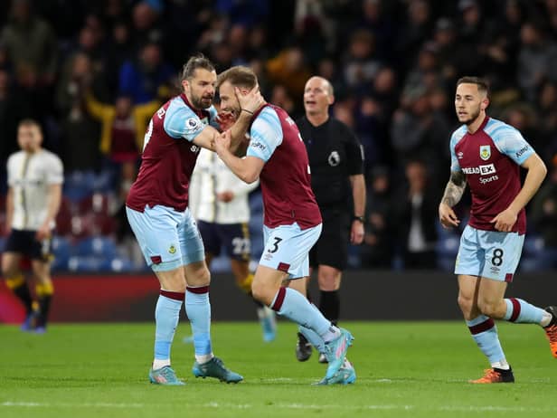 BURNLEY, ENGLAND - APRIL 06: Jay Rodriguez of Burnley (L) celebrates with teammate Charlie Taylor after scoring their team's second goal during the Premier League match between Burnley and Everton at Turf Moor on April 06, 2022 in Burnley, England. (Photo by Jan Kruger/Getty Images)