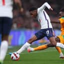 LONDON, ENGLAND - MARCH 29: Kyle Walker-Peters of England is tackled by Maxwel Cornet of Cote D'Ivoire during the international friendly match between England and Cote D'Ivoire at Wembley Stadium on March 29, 2022 in London, England. (Photo by Catherine Ivill/Getty Images)