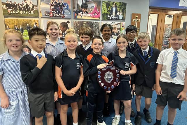 St Joseph's Park Hill pupils celebrate winning the Burnley Primary Schools Swimming Gala