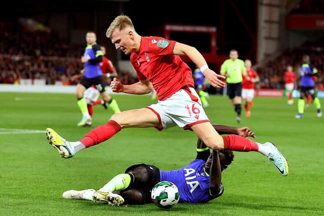 NOTTINGHAM, ENGLAND - NOVEMBER 09: Sam Surridge of Nottingham Forest is challenged by Davinson Sanchez of Tottenham Hotspur during the Carabao Cup Third Round match between Nottingham Forest and Tottenham Hotspur at City Ground on November 09, 2022 in Nottingham, England. (Photo by Catherine Ivill/Getty Images )