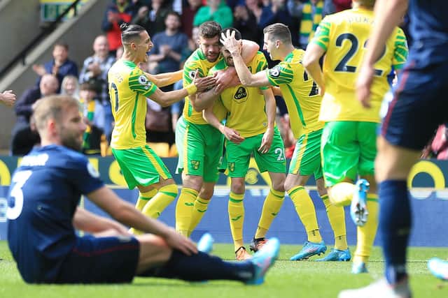 NORWICH, ENGLAND - APRIL 10: Pierre Lees Melou of Norwich City celebrates after scoring their side's first goal with team mates during the Premier League match between Norwich City and Burnley at Carrow Road on April 10, 2022 in Norwich, England. (Photo by Stephen Pond/Getty Images)