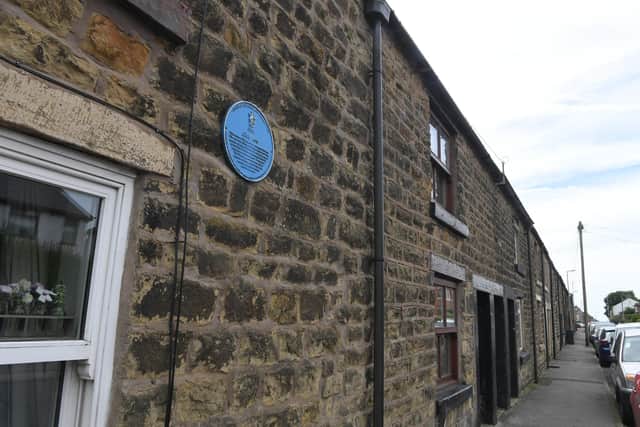 Blue plaque on Club Row - the properties were financed by one of the earliest "terminating building societies". The societies were disbanded when all the members had paid for their homes. Photo Neil Cross
