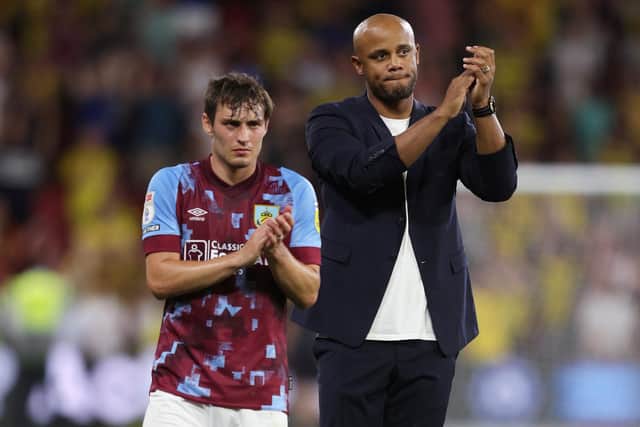 WATFORD, ENGLAND - AUGUST 12: Connor Roberts and Vincent Kompany, Manager of Burnley, look dejected as they applaud their fans after the final whistle of the Sky Bet Championship between Watford and Burnley at Vicarage Road on August 12, 2022 in Watford, England. (Photo by Richard Heathcote/Getty Images)