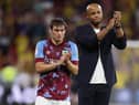 WATFORD, ENGLAND - AUGUST 12: Connor Roberts and Vincent Kompany, Manager of Burnley, look dejected as they applaud their fans after the final whistle of the Sky Bet Championship between Watford and Burnley at Vicarage Road on August 12, 2022 in Watford, England. (Photo by Richard Heathcote/Getty Images)