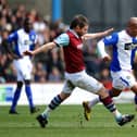 BURNLEY, ENGLAND - MARCH 28: El-Hadji Diouf of Blackburn battles with Graham Alexander of Burnley during the Barclays Premier League match between Burnley and Blackburn Rovers at Turf Moor on March 28, 2010 in Burnley, England.  (Photo by Laurence Griffiths/Getty Images)
