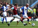 BURNLEY, ENGLAND - MARCH 28: El-Hadji Diouf of Blackburn battles with Graham Alexander of Burnley during the Barclays Premier League match between Burnley and Blackburn Rovers at Turf Moor on March 28, 2010 in Burnley, England.  (Photo by Laurence Griffiths/Getty Images)