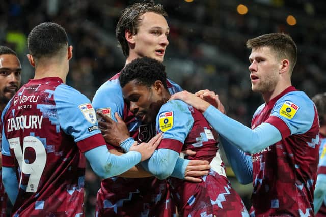 Burnley's Nathan Tella celebrates scoring the opening goal with teammates
The EFL Sky Bet Championship - Hull City v Burnley - Wednesday 15th March 2023 - MKM Stadium - Kingston upon Hull