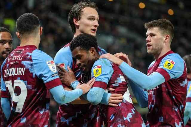 Burnley's Nathan Tella celebrates scoring the opening goal with teammates 

The EFL Sky Bet Championship - Hull City v Burnley - Wednesday 15th March 2023 - MKM Stadium - Kingston upon Hull