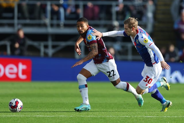 BURNLEY, ENGLAND - NOVEMBER 13: Vitinho of Burnley is challenged by Jake Garrett of Blackburn Rovers during the Sky Bet Championship between Burnley and Blackburn Rovers at Turf Moor on November 13, 2022 in Burnley, England. (Photo by Nathan Stirk/Getty Images)