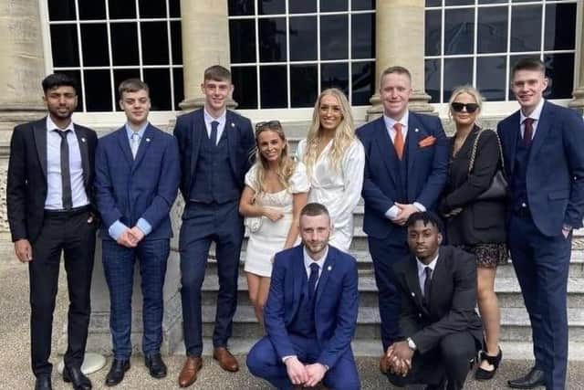 Andrew Trickett (back row third from right) and fellow Burnley College students at Buckingham Palace to receive their Duke of  Edinburgh gold awards