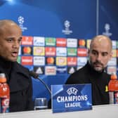 Manchester City's Belgian defender Vincent Kompany (L) and Manchester City's Spanish coach Pep Guardiola hold a press conference on February 12, 2018, in Basel, on the eve of the UEFA Champions League round of 16 football between Basel and Manchester City. / AFP PHOTO / SEBASTIEN BOZON