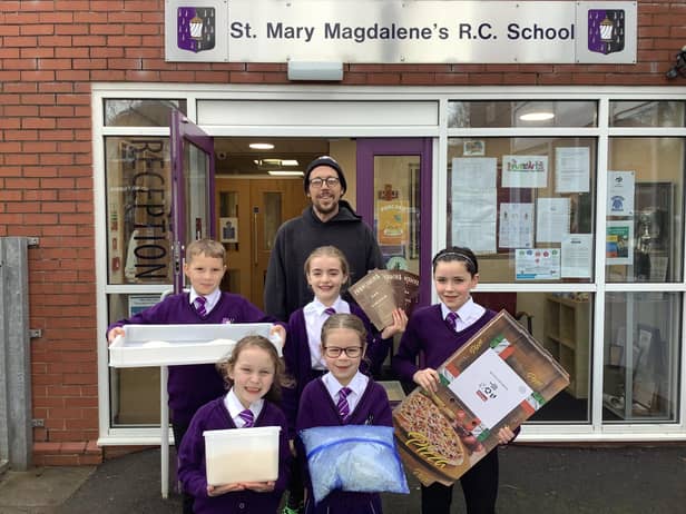 Year 4 pupils from St Mary Magdalen's RC Primary School, Burnley, with their donated pizza supplies