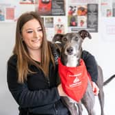 Portia Keates, branch co-ordinator at Stanley House Vets in Barnoldswick, with her lifesaving Greyhound Blake. Photo: Stanley House Vets