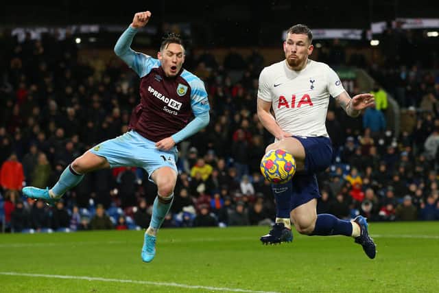 BURNLEY, ENGLAND - FEBRUARY 23: Pierre-Emile Hojbjerg of Tottenham Hotspur is challenged by Connor Roberts of Burnley during the Premier League match between Burnley and Tottenham Hotspur at Turf Moor on February 23, 2022 in Burnley, England.