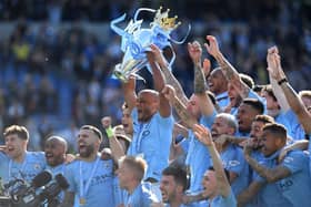 BRIGHTON, ENGLAND - MAY 12:   Manchester City captain Vincent Kompany lifts the Premier League Trophy after the Premier League match between Brighton & Hove Albion and Manchester City at American Express Community Stadium on May 12, 2019 in Brighton, United Kingdom. (Photo by Shaun Botterill/Getty Images)