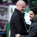 BURNLEY, ENGLAND - FEBRUARY 02: Sean Dyche, Manager of Burnley embraces Mikel Arteta, Manager of Arsenal prior to the Premier League match between Burnley FC and Arsenal FC at Turf Moor on February 02, 2020 in Burnley, United Kingdom.