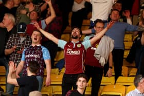 WATFORD, ENGLAND - APRIL 30: Burnley fans celebrate at full time after the Premier League match between Watford and Burnley at Vicarage Road on April 30, 2022 in Watford, England. (Photo by Julian Finney/Getty Images)