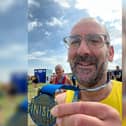 Neil Welsh, of Burnley, with his medal from the Great North Run 2022.