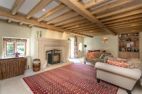 Spacious living room with log-burning stove