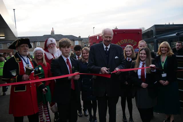 Clitheroe's Ribblesdale School has celebrated a landmark 90th year with a Christmas fair and Lord Shuttleworth ( seen here cutting the ribbon) was among the VIP guests