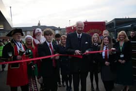 Clitheroe's Ribblesdale School has celebrated a landmark 90th year with a Christmas fair and Lord Shuttleworth ( seen here cutting the ribbon) was among the VIP guests
