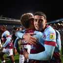 BLACKBURN, ENGLAND - APRIL 25: Anass Zaroury of Burnley celebrates with teammate Manuel Benson after winning the Sky Bet Championship following victory against the Blackburn Rovers and Burnley at Ewood Park on April 25, 2023 in Blackburn, England. (Photo by Matt McNulty/Getty Images)