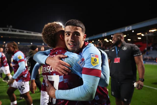 BLACKBURN, ENGLAND - APRIL 25: Anass Zaroury of Burnley celebrates with teammate Manuel Benson after winning the Sky Bet Championship following victory against the Blackburn Rovers and Burnley at Ewood Park on April 25, 2023 in Blackburn, England. (Photo by Matt McNulty/Getty Images)